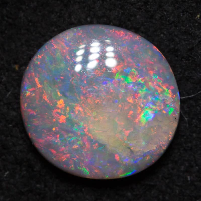 0.49 ct dark opal 7x7x2mm