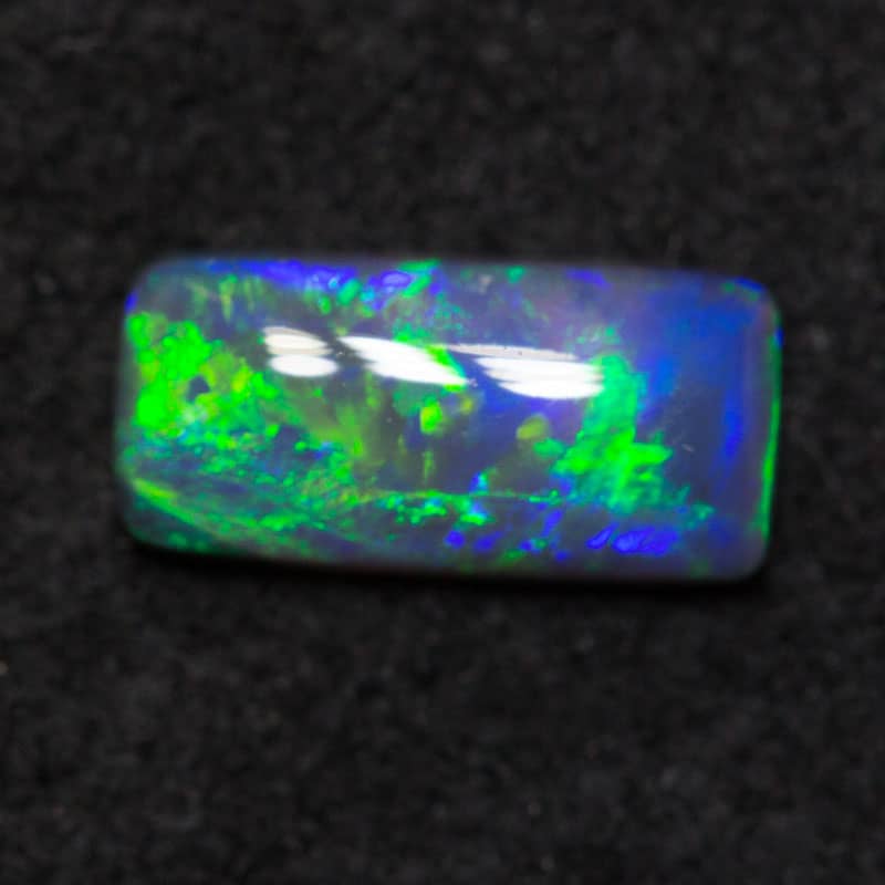 0.50 ct black opal 8.1x3.9x1.9mm