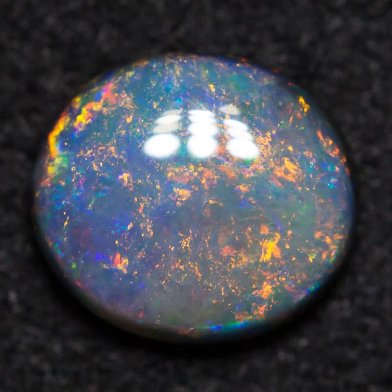 0.50ct black opal 6.1x5.4x2.3mm