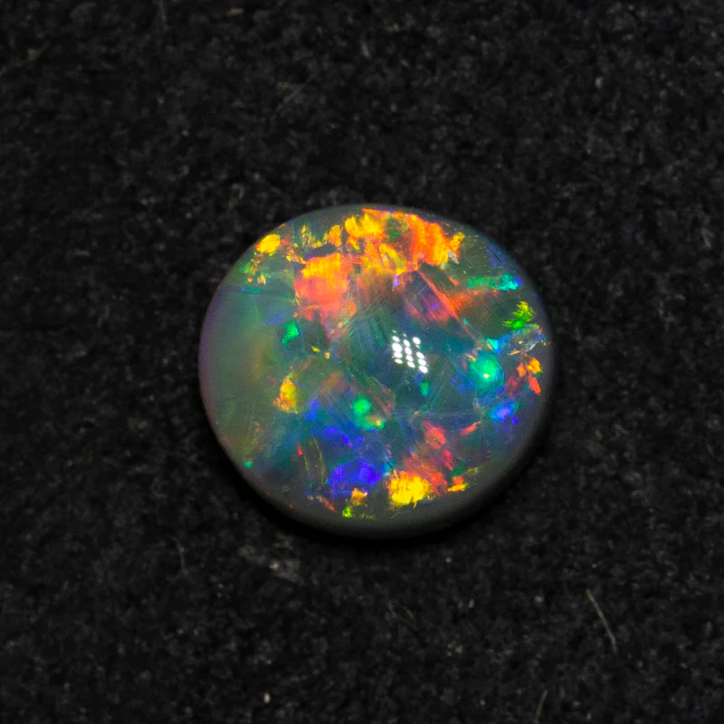 0.51 ct black opal 5.8x5.3x2.8mm
