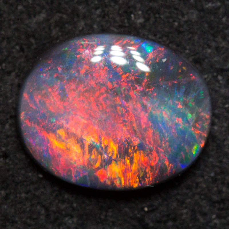 0.51 ct black opal 6.7x5.5x1.9mm