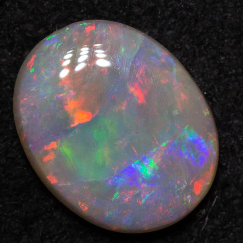 0.51 ct dark opal 7.1x5.8x1.9mm