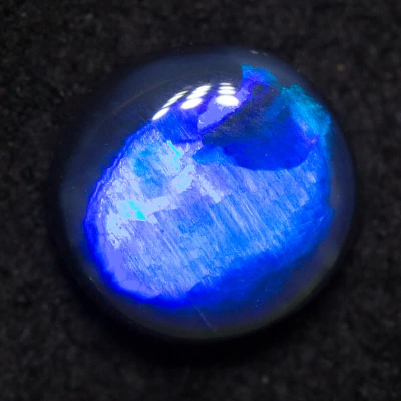 0.52 ct black opal 5.6x5.5x2.6mm