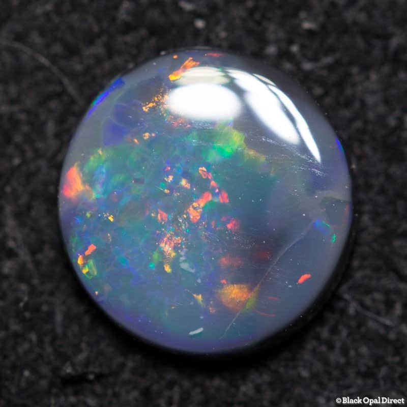 0.52 ct black opal 6mm round x 1.5mm