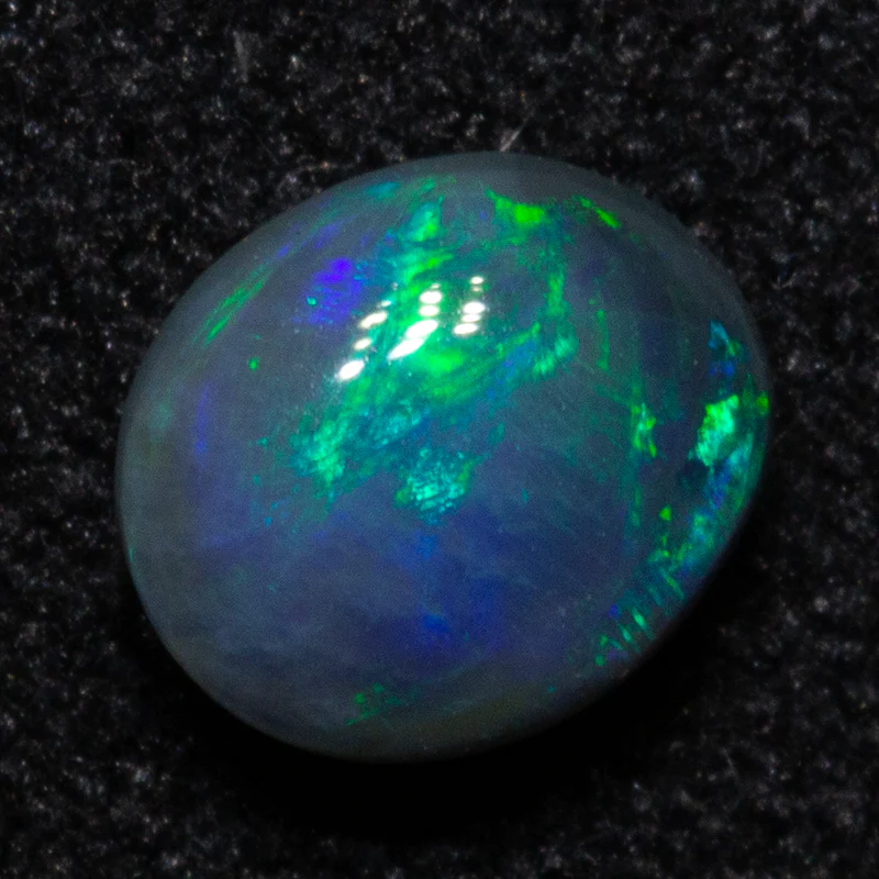 0.52 ct dark opal 5.6x4.8x3.1mm