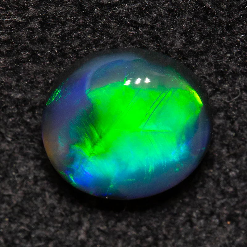 0.54 ct black opal 5.8x5.3x2.5mm