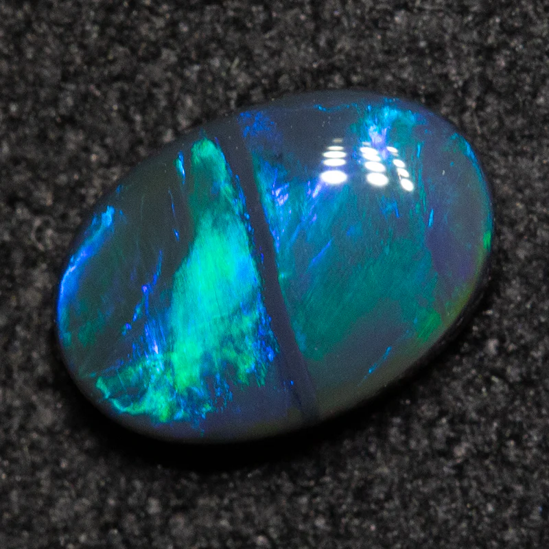0.54 ct black opal 6.8x4.8x2.4mm