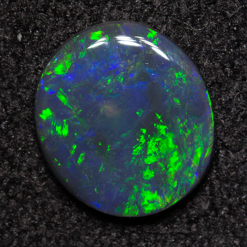 0.54 ct black opal 7.5x6.8x1.4mm
