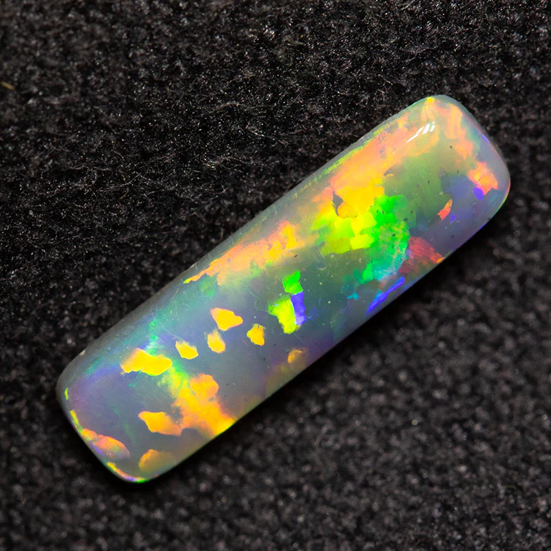 0.54 ct dark opal 10.9x3.2x1.8mm