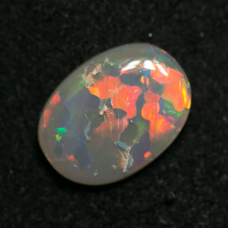 0.54 ct dark opal 7x6x1.5mm