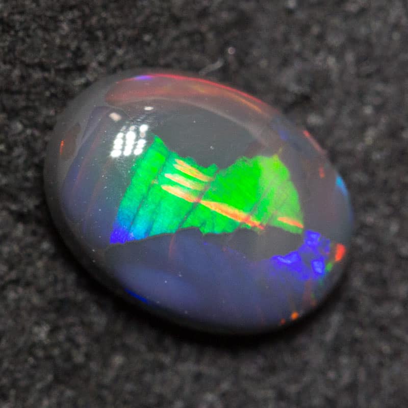 0.55 ct black opal 6.8x4.9x2.5mm