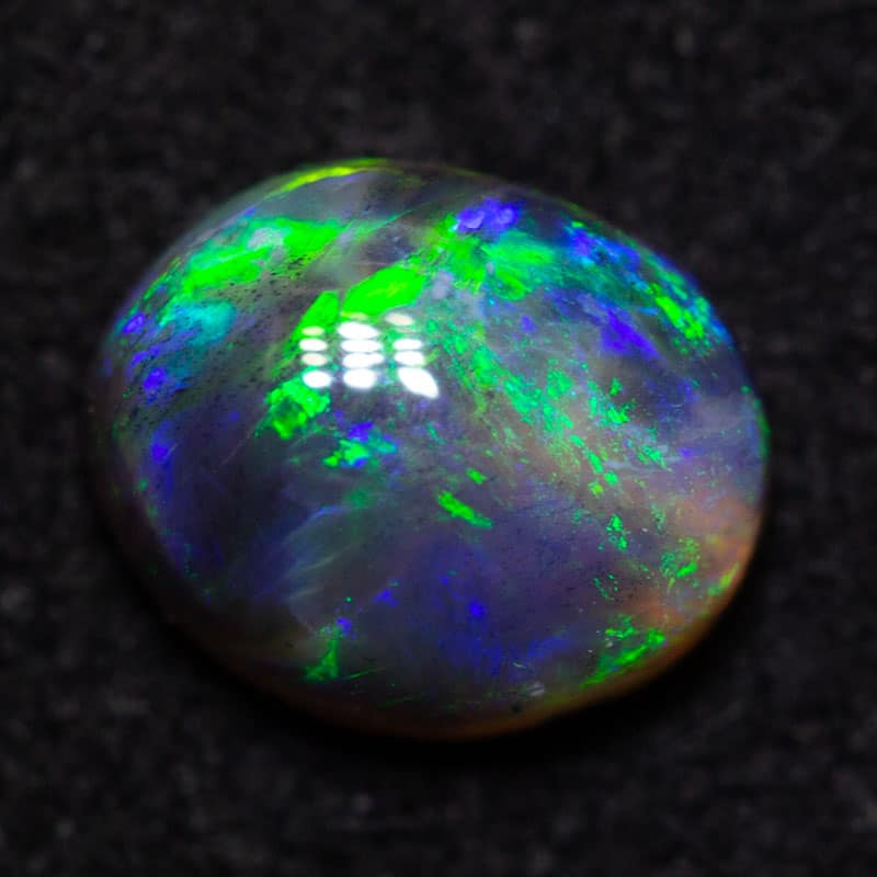 0.55 ct black opal 6x4.9x.3.1mm