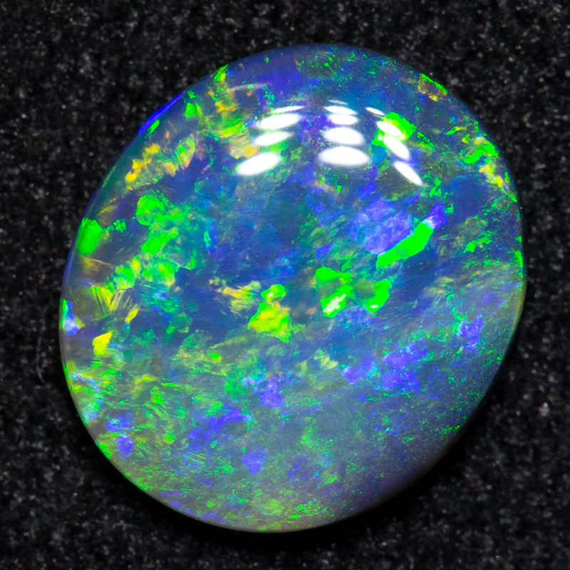 0.55 ct black opal 7.1x6.3x1.9mm