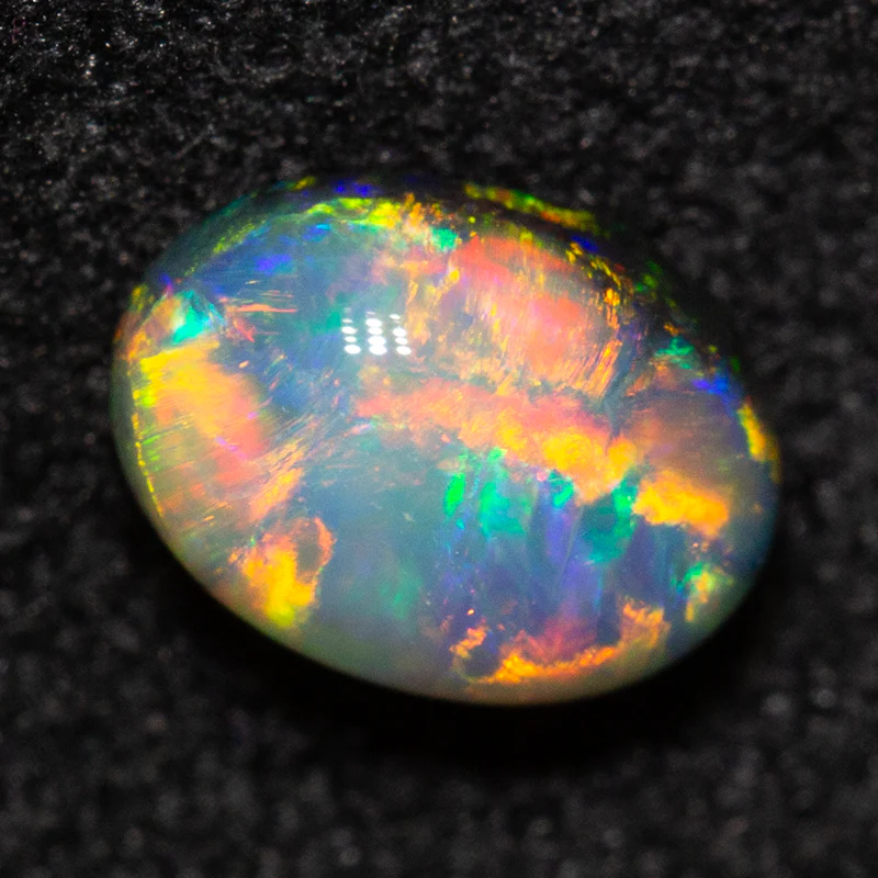 0.55 ct dark opal 6.2x4.4x3.1mm