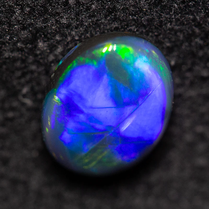 0.55 ct double-sided black opal 6.6x5.2x2.3mm