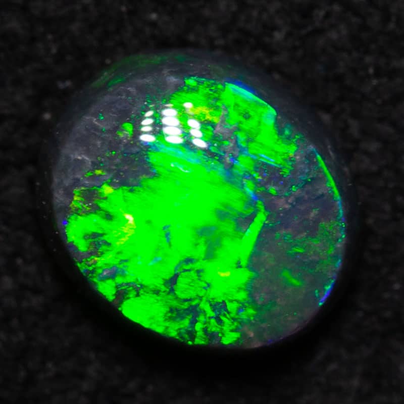 0.56 ct black opal 5.9x5.1x3mm