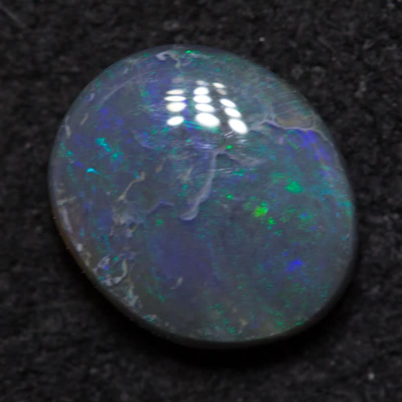 0.56 ct black opal 6.5x5x2mm