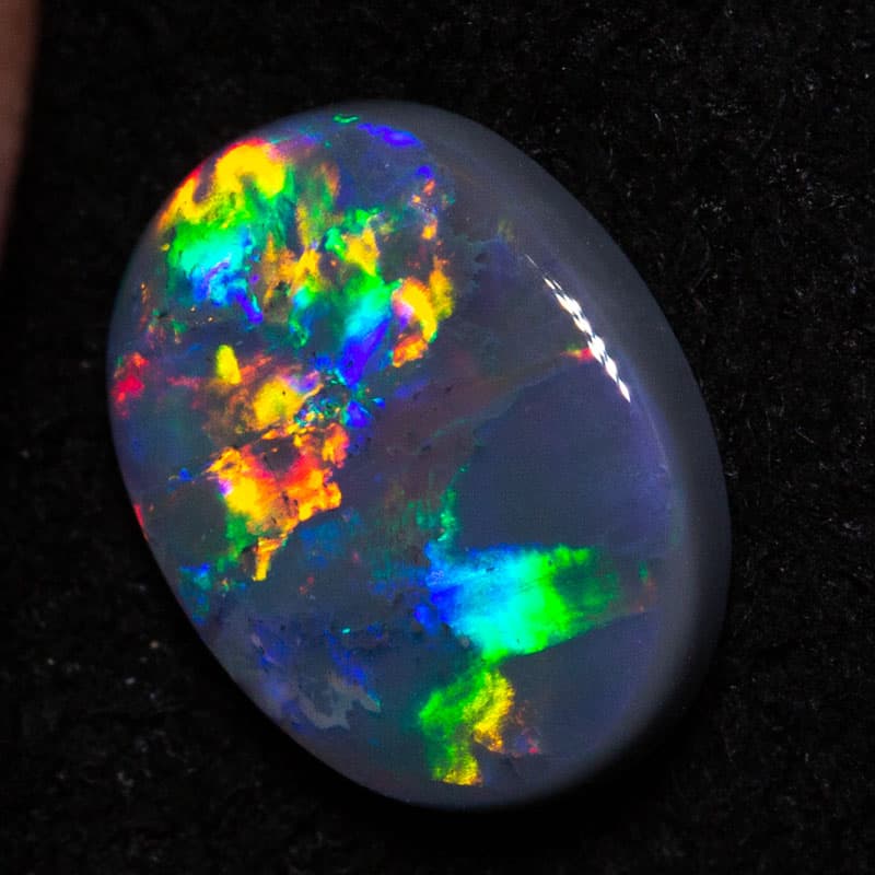 0.56 ct black opal 7.3x5.5x2mm