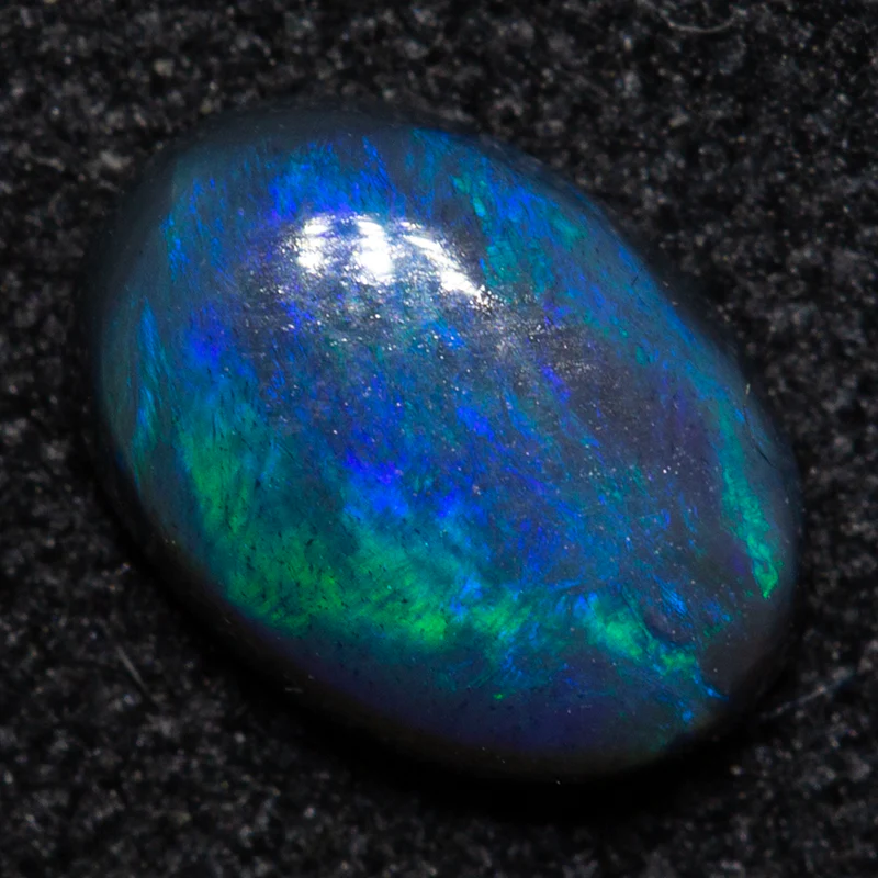 0.57 ct black opal 6.8x4.9x2.5mm