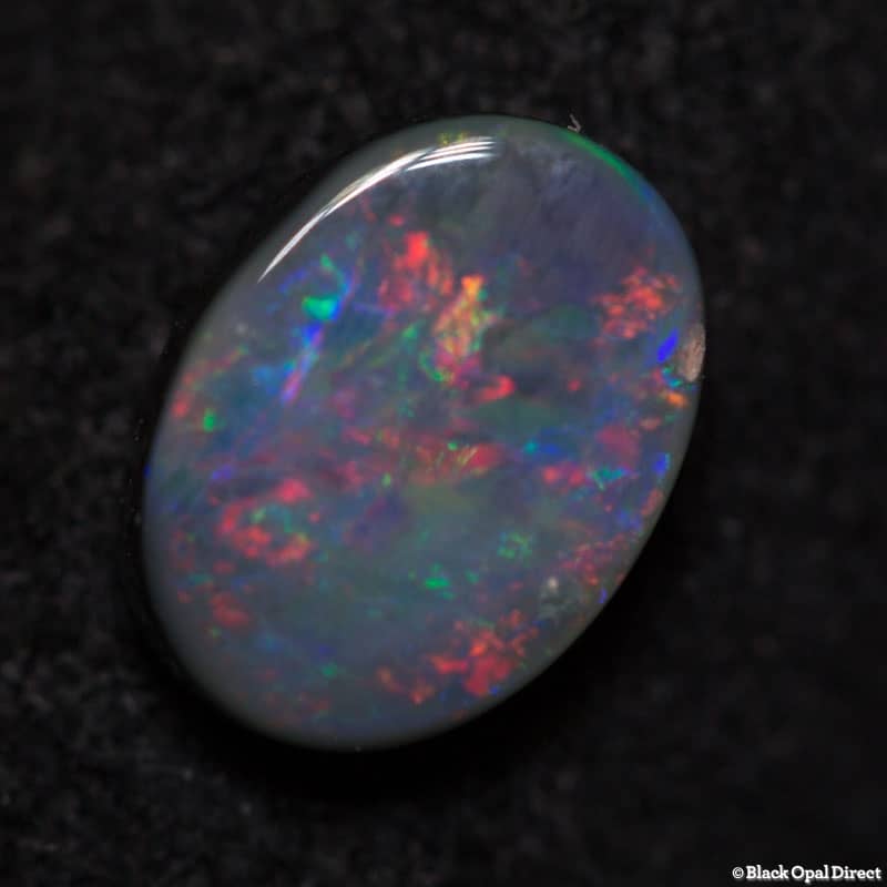0.57 ct dark opal 6.3x4.8x2mm