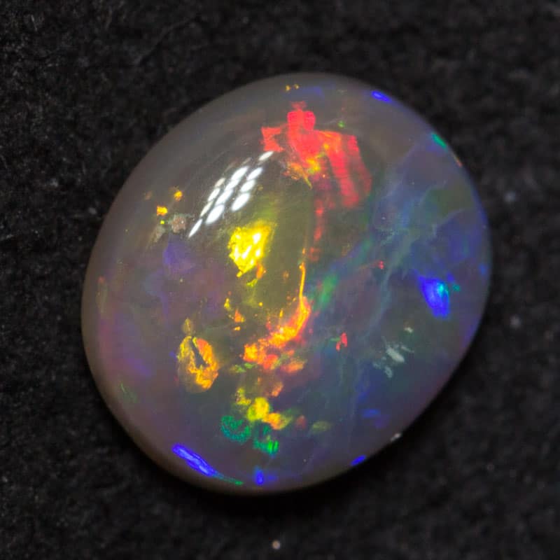 0.57 ct dark opal 6.5x6x2mm