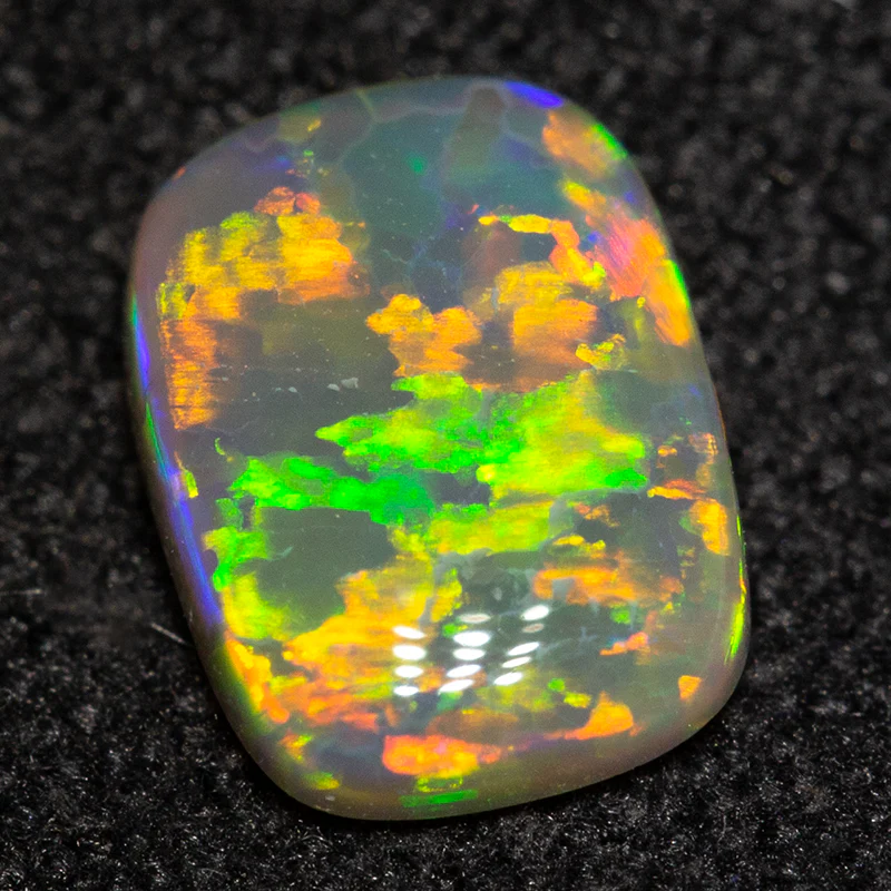 0.57 ct dark opal 6.9x5.2x1.9mm