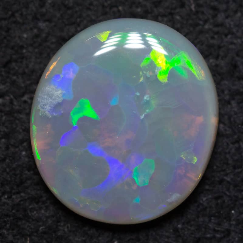 0.57 ct dark opal 8x7x2mm