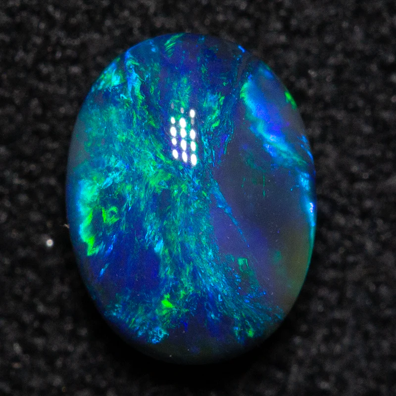 0.58 ct black opal 6.1x4.6x3.1mm