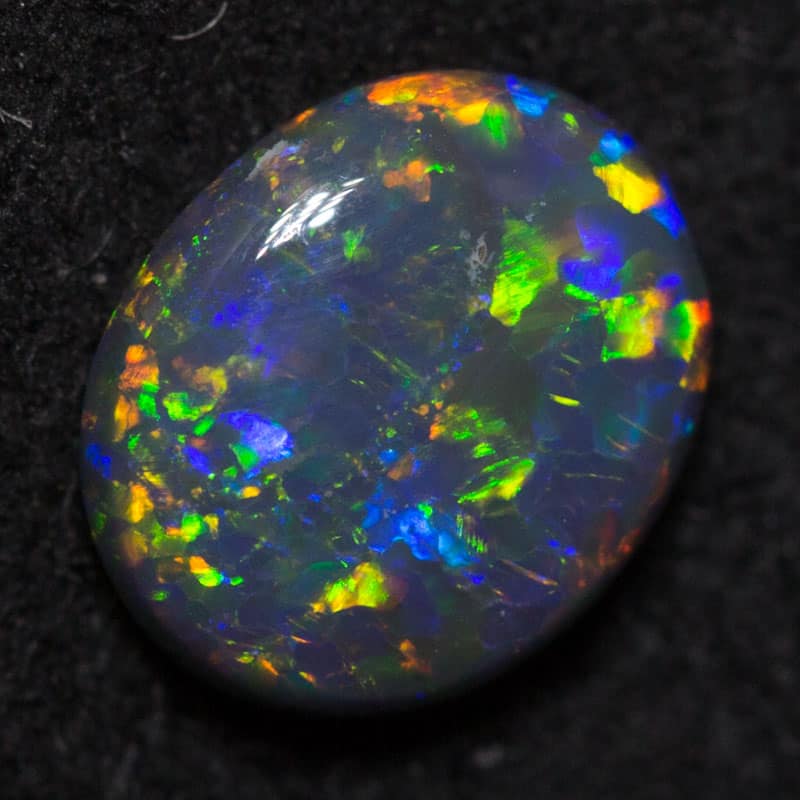 0.58 ct black opal 6.5x5x2mm
