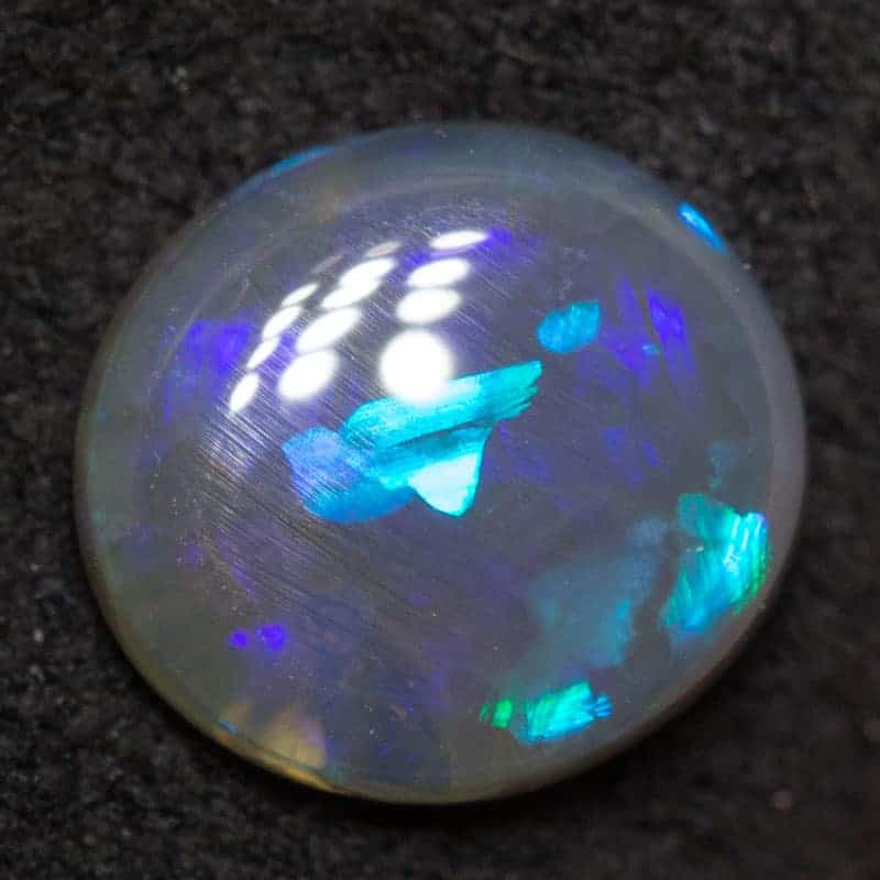 0.58 ct black opal 7x6.4x1.9mm