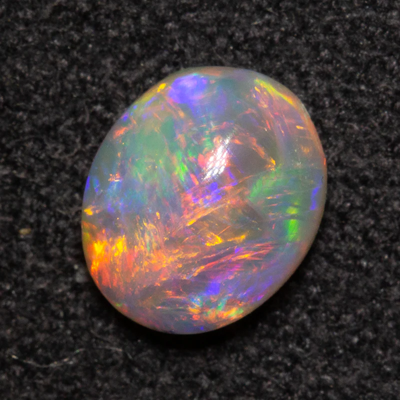 0.58 ct dark opal 6.4x5.4x3mm