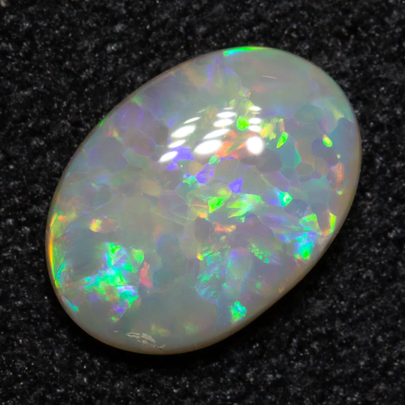 0.58 ct dark opal 7.5x5.3x2.3mm