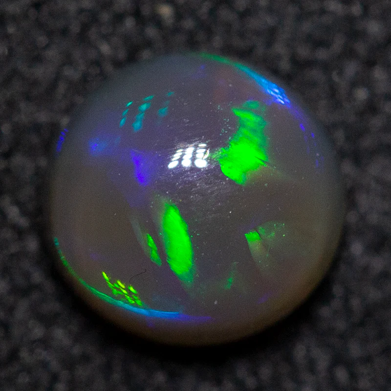 0.59 ct black crystal opal 5.5x5.4x3.2mm