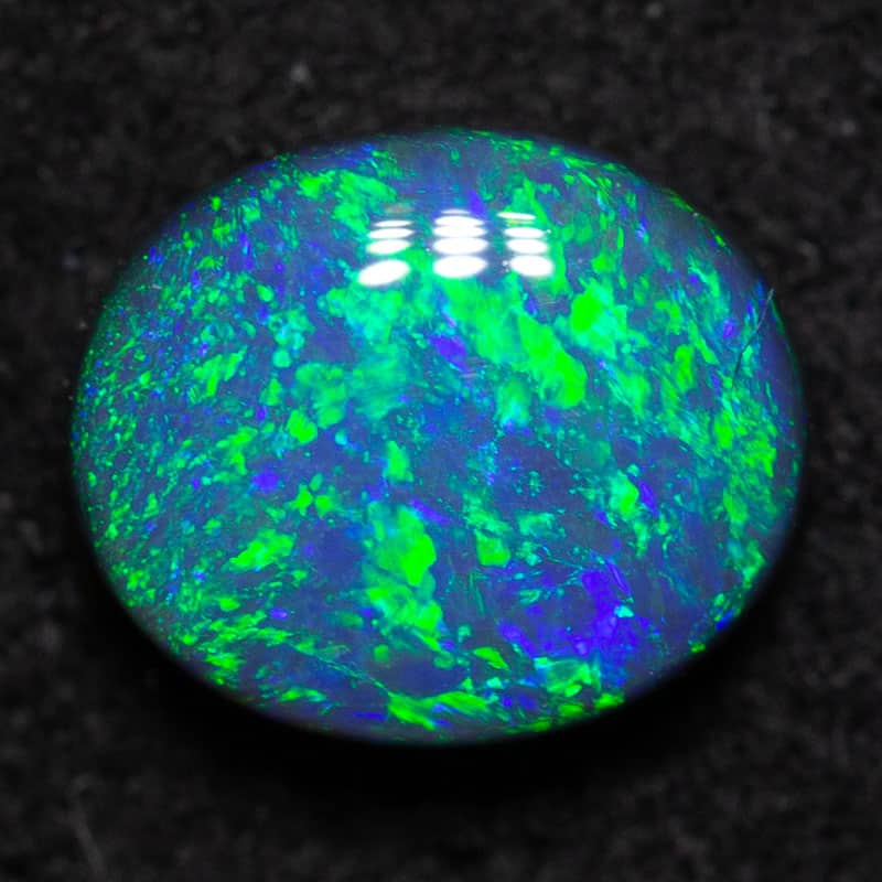 0.59 ct black opal 6.3x5.3x2.7mm