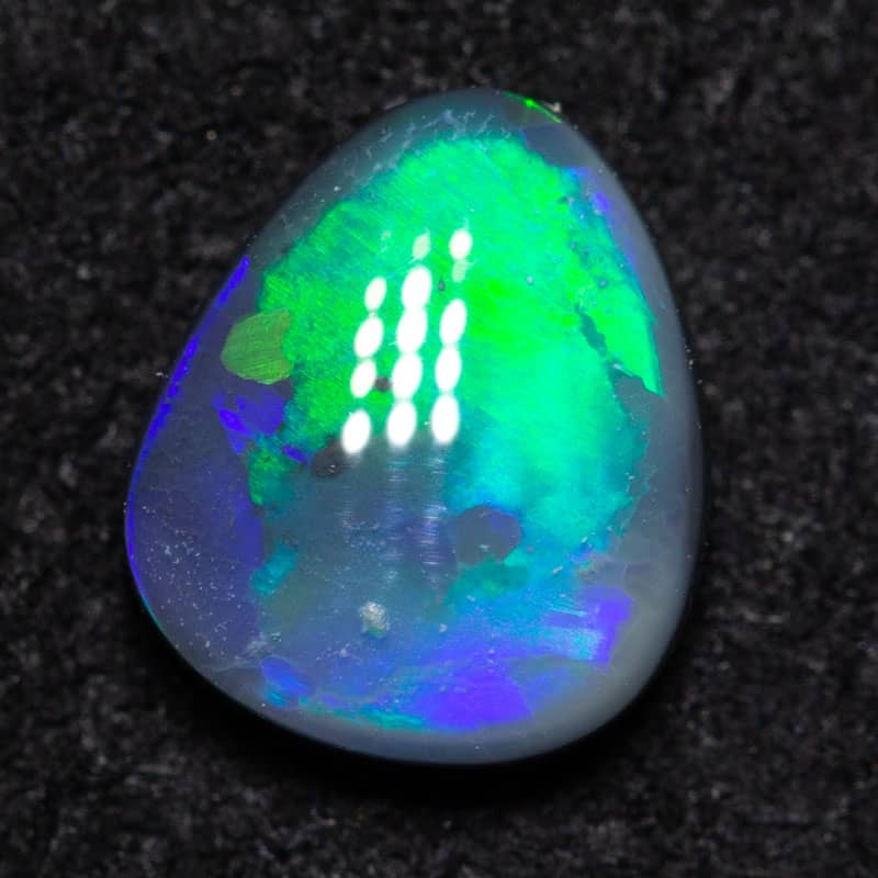 0.59ct black opal 6.5x5.5x2.5mm
