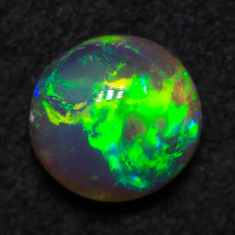 0.60 ct black crystal opal 5.8mm round x3mm