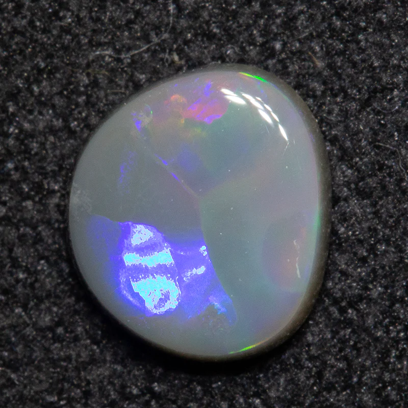 0.60 ct dark opal 6.4x5.8x2.2mm
