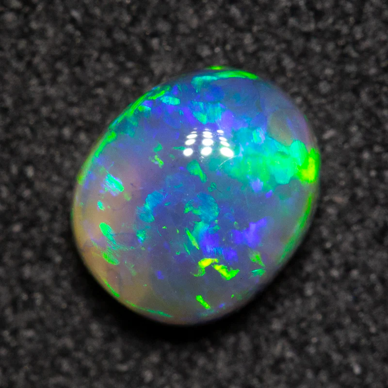 0.61 ct black opal 5.7x4.9x3.2mm