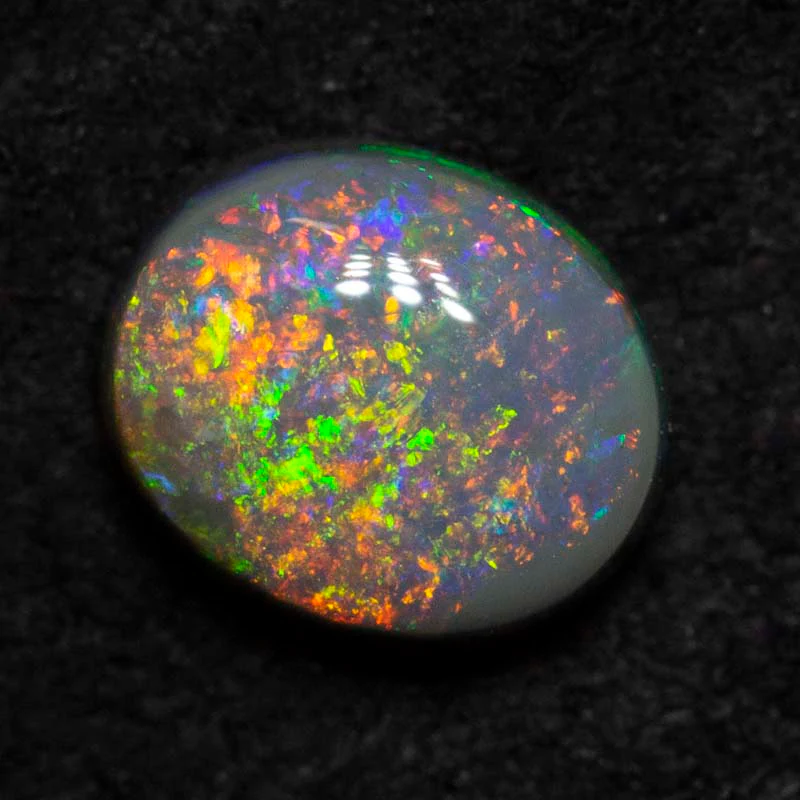 0.61 ct black opal 6.1x5.1x2.8mm