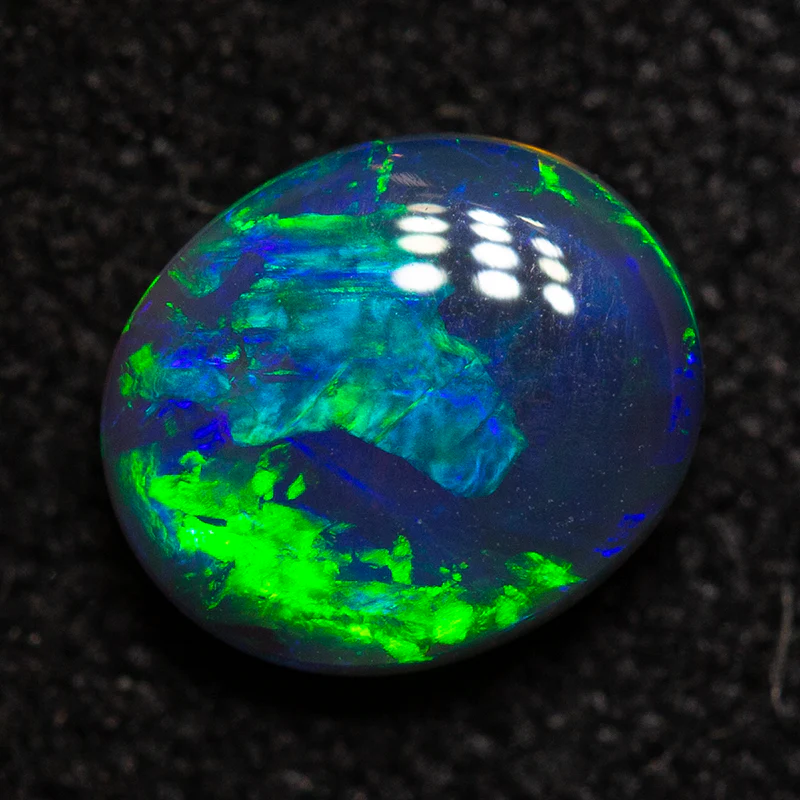 0.61 ct black opal 6.2x5.3x2.8mm
