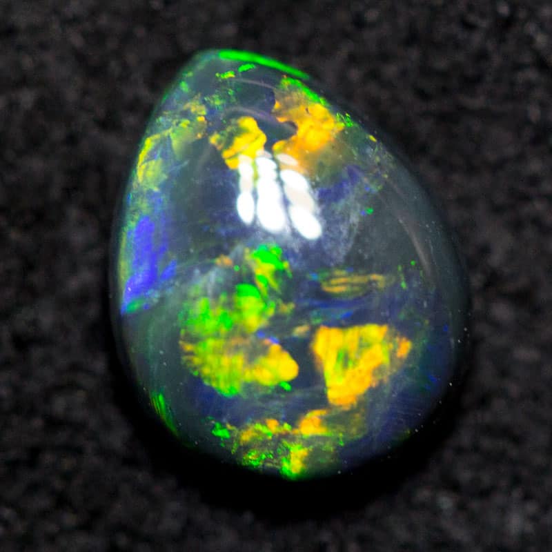 0.61 ct black opal 6.6x5.2x2.7mm