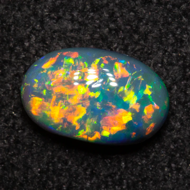 0.61 ct double-sided black opal 6.9x4.4x2.9mm
