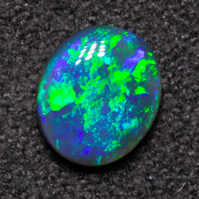0.62 ct black opal 6.4x5.5x2.7mm