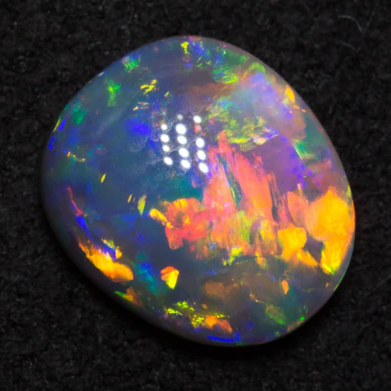 0.62 ct black opal 6.9x5.8x2.5mm