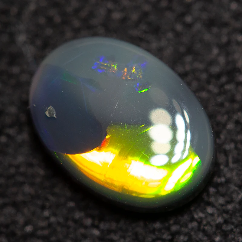 0.62 ct black opal 7x5x2.5mm