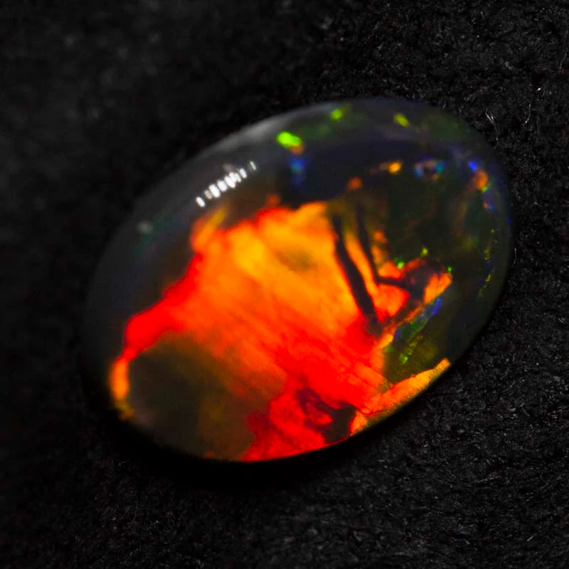 0.62 ct black opal 8.4x6.9x1.6mm