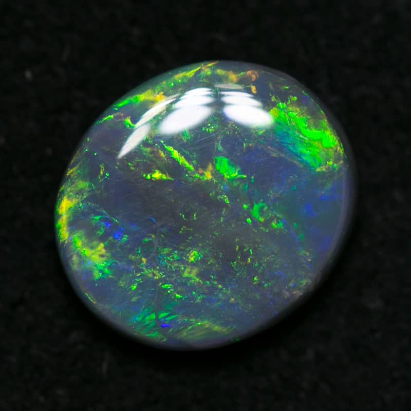 0.63 ct dark opal 7x6x2mm