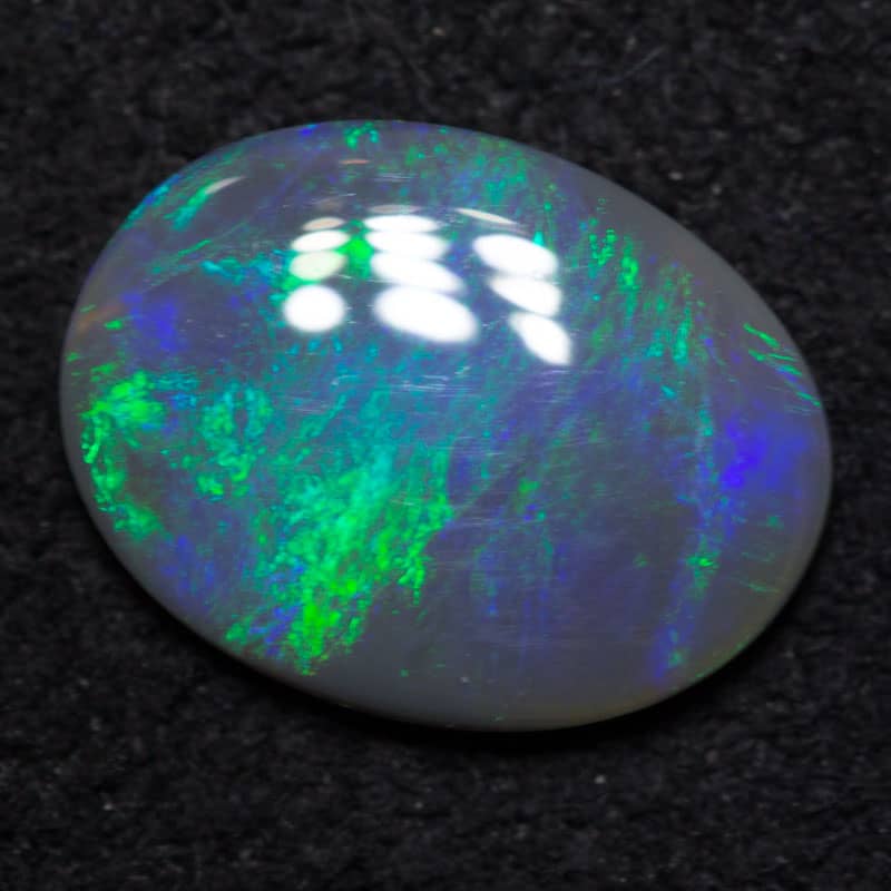 0.63 ct dark opal 8.5x6.5x1.5mm