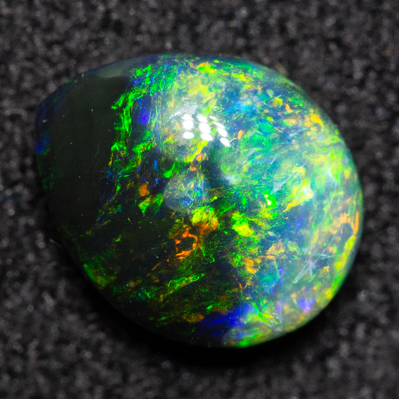 0.64 ct black opal 6.6x5.4x3mm
