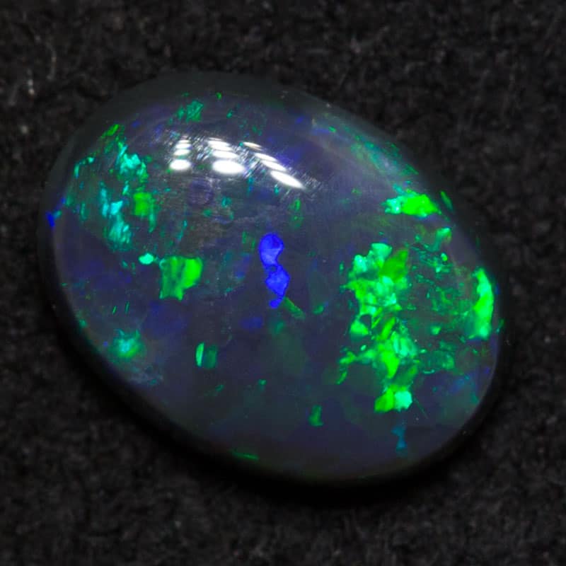 0.64 ct black opal 6.9x5.1x2.6mm
